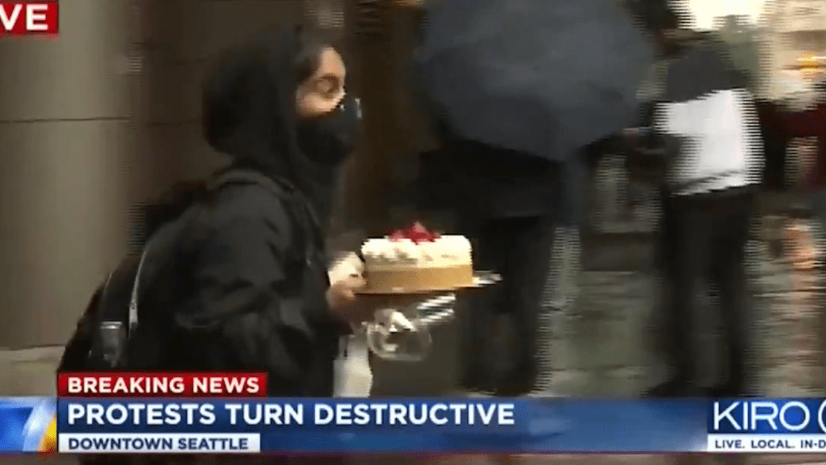 Thumbnail of US Protester Attains Internet Icon Status After Looting Whole Cheesecake & Wine Glasses