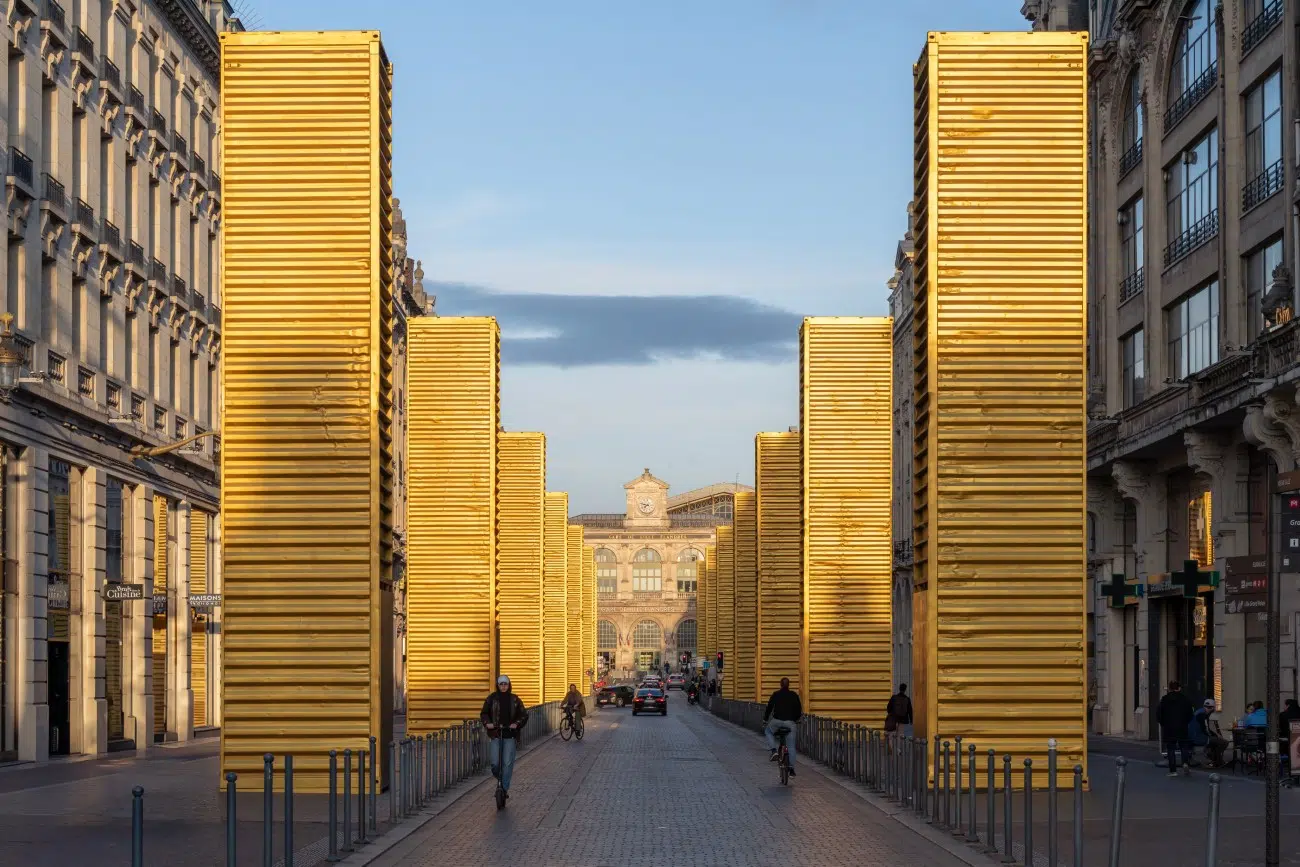 Thumbnail of Artist Transforms Humble Shipping Containers Into Monumental Gold Columns
